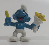 Vintage 1980 Peyo Smurf Character Holding and Eating French Fries PVC Toy Figure