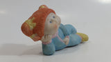 1984 OAA Cabbage Patch Kids Orange Hair Girl in Light Blue Laying Ceramic Figurine
