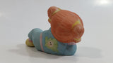 1984 OAA Cabbage Patch Kids Orange Hair Girl in Light Blue Laying Ceramic Figurine
