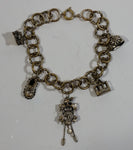 Mountain Log Cabin, Gondola, Boots, Cuckoo Clock, and Flower Dinner Bell Themed Charms 8" Long Metal Bracelet