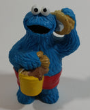 Applause Muppets Sesame Street Cookie Monster Character In Beach Shorts with a Pail of Shells Holding a Conch Shell To His Ear 3" Tall Hard Rubber PVC Toy