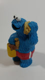 Applause Muppets Sesame Street Cookie Monster Character In Beach Shorts with a Pail of Shells Holding a Conch Shell To His Ear 3" Tall Hard Rubber PVC Toy