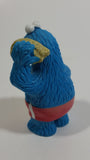 Applause Muppets Sesame Street Cookie Monster Character In Beach Shorts with a Pail of Shells Holding a Conch Shell To His Ear 3" Tall Hard Rubber PVC Toy