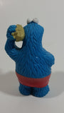 Applause Muppets Sesame Street Cookie Monster Character In Beach Shorts with a Pail of Shells Holding a Conch Shell To His Ear 3" Tall Hard Rubber PVC Toy