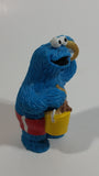Applause Muppets Sesame Street Cookie Monster Character In Beach Shorts with a Pail of Shells Holding a Conch Shell To His Ear 3" Tall Hard Rubber PVC Toy