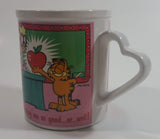 Enesco United Features Syndicate Jim Davis "Thanks for teaching me so good...er...well!" Garfield Giving Apple To Teacher Ceramic Coffee Mug with Heart Shaped Handle