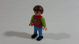 1995 Geobra Playmobil Brown Haired Boy Blue Pants Red Top Green Sleeves 2" Tall Toy Figure