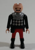 1993 Geobra Playmobil No Hair Knight in Red Bottoms Black Top with Silver Dots and collar  3" Tall Toy Figure Wearing a Holster