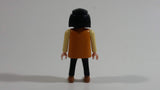 1994 Geobra Playmobil Black Haired Pirate Man Black Bottoms Tan Orange Top White Sleeves Stubble and Eye patch 3" Tall Toy Figure