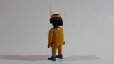 1993 Geobra Playmobil Black Haired Native American Indian Man Yellow Bottoms Yellow Top with Yellow Band with White Feather 3" Tall Toy Figure
