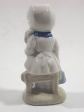 Vintage Blue and White Delft Style Girl Holding Puppy Porcelain Figure 3 3/4" Tall