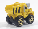 1987 Road Champs Dump Truck Yellow Micro Mini Die Cast Toy Car Construction Vehicle
