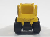 1987 Road Champs Dump Truck Yellow Micro Mini Die Cast Toy Car Construction Vehicle