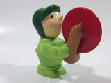 Man wearing Green Holding Red Plastic Saw 3" Tall Plastic Toy Figure
