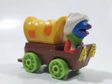 1987 Playskool Muppets Sesame Street Cowboy Grover Chuck Wagon Yellow and Brown Die Cast Toy Car Vehicle