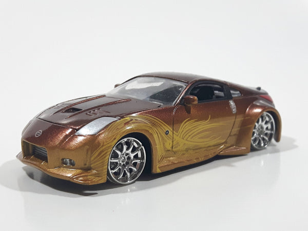 ERTL Joy Ride Universal Studios Fast and Furious Tokyo Drift 2006 Nissan 350Z Gold and Brown Die Cast Toy Car Vehicle Missing Tires 3 1/4" Long