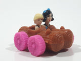 1993 McDonald's U.C.S. & Amblin The Flintstones Betty Rubble and Bamm Bamm in Log Car Plastic Toy Vehicle 1 3/4" Long