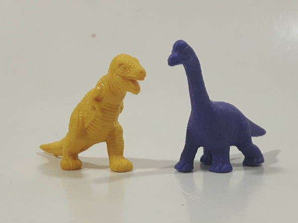 Set of 2 Toy Rubber Dinosaur Figures One Yellow One Purple