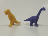 Set of 2 Toy Rubber Dinosaur Figures One Yellow One Purple