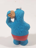 Applause Muppets Sesame Street Cookie Monster Character In Beach Shorts with a Pail of Shells Holding a Conch Shell To His Ear 3" Tall PVC Toy Figure