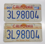 Matching Set of 2 1982-1989 California in Red with Yellow Sun, Stripes and The Golden State on White with Blue Letters Vehicle License Plate 3L98004