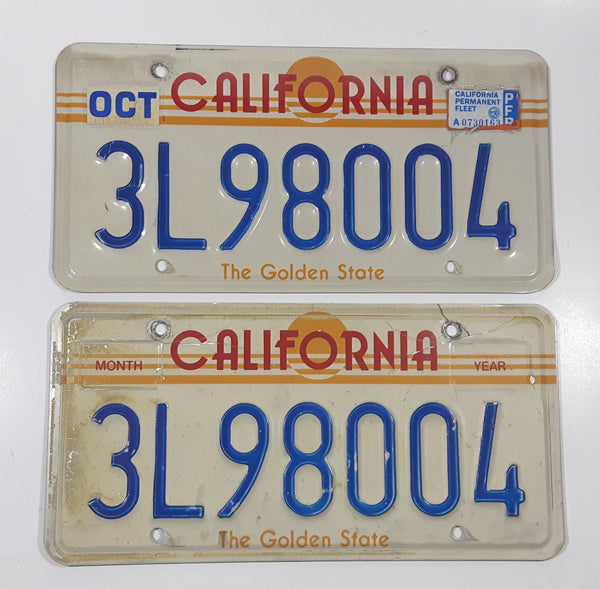 Matching Set of 2 1982-1989 California in Red with Yellow Sun, Stripes and The Golden State on White with Blue Letters Vehicle License Plate 3L98004