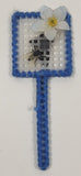 Blue Yarn Trimmed Plastic Mesh Fly Swatter with Fly and White Flower 1 3/8" x 4" Fridge Magnet