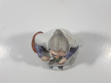 Old Woman Sitting with Basket of Bread Holding a Pear and Banana 6 1/2" Tall Porcelain Figurine