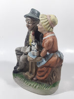 Vintage Old Man and Woman Couple Woman Whispering In His Ear Book and Teapot Set 7" Tall Figurine Sculpture