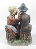 Vintage Old Man and Woman Couple Woman Whispering In His Ear Book and Teapot Set 7" Tall Figurine Sculpture