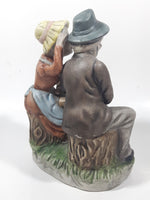 Vintage Old Man and Woman Couple Woman Whispering In His Ear Book and Teapot Set 7" Tall Figurine Sculpture