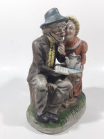 Vintage Old Man and Woman Couple Woman Whispering In His Ear Book and Teapot Set 7" Tall Figurine Sculpture