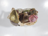 Vintage Man and Woman Sitting Holding Flowers 6 1/4" Tall Porcelain Figurine