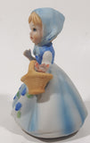 Vintage Girl and Blue and White Floral Dress Wearing a Bonnet and Holding a Basket 4 1/2" Tall Porcelain Figurine