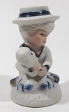 Vintage Brinns Blue and White French Colonial Boy Holding White Puppy Dog 4" Tall Porcelain Figurine