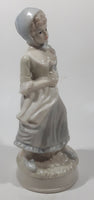 Vintage Sabre Fine Gifts Light Blue and Cream Woman in Bonnet Holding Flowers 8" Tall Ceramic Figurine
