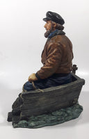 Captain on Rickety Boat Sitting In Busted Up Broken Life Raft Row Boat 9" Tall Weight Resin Figurine
