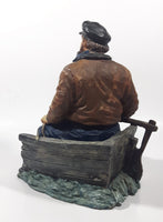 Captain on Rickety Boat Sitting In Busted Up Broken Life Raft Row Boat 9" Tall Weight Resin Figurine