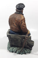 Captain on Rickety Boat Sitting In Busted Up Broken Life Raft Row Boat 9" Tall Weight Resin Figurine