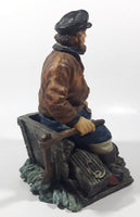 Captain on Rickety Boat Sitting In Busted Up Broken Life Raft Row Boat 9" Tall Weight Resin Figurine