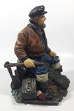 Captain on Rickety Boat Sitting In Busted Up Broken Life Raft Row Boat 9" Tall Weight Resin Figurine