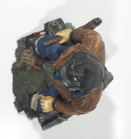 Captain on Rickety Boat Sitting In Busted Up Broken Life Raft Row Boat 9" Tall Weight Resin Figurine