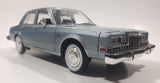 2011 Motor Max No. 73333 1986 Dodge Diplomat Metallic Light Blue 1/24 Scale 8 1/2" Long Die Cast Toy Car Vehicle with Opening Front Doors and Hood