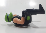Black and Green Character with Helmet In Riding Pose 3 3/4" Tall Toy Figure