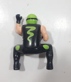 Black and Green Character with Helmet In Riding Pose 3 3/4" Tall Toy Figure