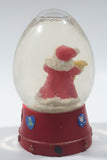 Santa Claus 4 1/4" Tall Red Resin Snow Globe