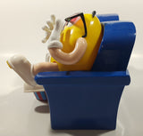 1999 M & M's Red And Yellow Character Sitting In Movie Theater Chairs Eating Popcorn Wearing 3D Glasses Plastic Candy Dispenser Machine