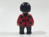 1990 Geobra Playmobil Boy with Black Hair in Red Shirt with Grey Vest and Black Pants 2 1/4" Tall Toy Figure