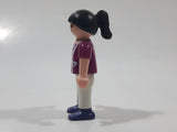 1995 Geobra Playmobil Girl with Black Hair in Purple Top and White Pants 2" Tall Toy Figure