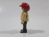 1992 Geobra Playmobil Boy with Black Hair Red Cap in Cream Vest and Green Top and Green Pants 2 1/8" Tall Toy Figure